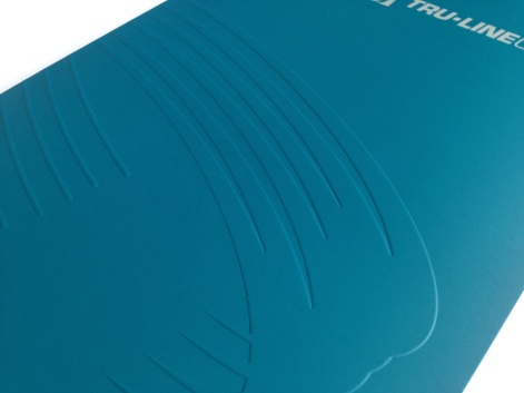 Detail of the cover of Tru-Line Civil presentation folder with a focus on the up-scale blind emboss of the logo the core of the corporate identity system. Craftsmanship is attention to detail.